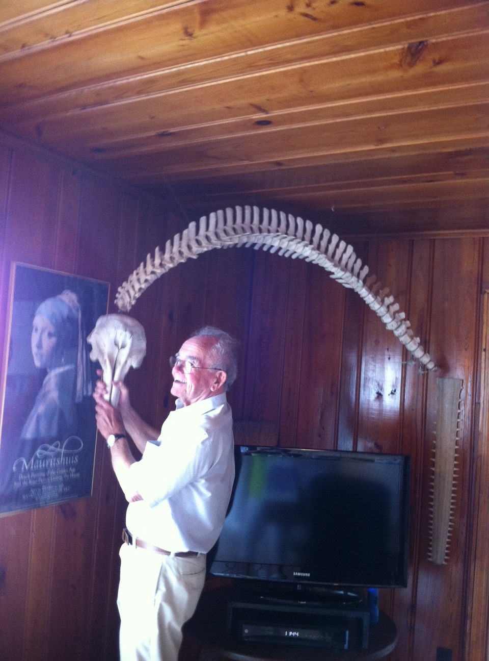Frank Nesmith and the dolphin he found on Sunset Beach